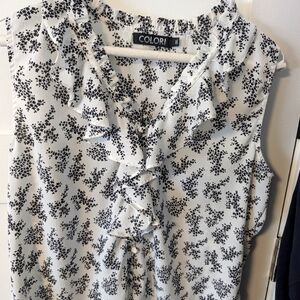 Women's Black and White Floral Sleeveless Blouse.